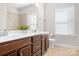 Elegant bathroom with double vanity, large mirror, and tile flooring at 6361 Willow Farm Dr, Denver, NC 28037