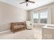 Charming Bedroom featuring a crib, rocker, and ample window light at 6361 Willow Farm Dr, Denver, NC 28037