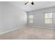 Bright bedroom with neutral walls and carpet flooring at 6361 Willow Farm Dr, Denver, NC 28037