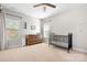 Bright bedroom with a crib, dresser, and plenty of natural light at 6361 Willow Farm Dr, Denver, NC 28037