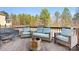 Spacious deck with wicker furniture and fire pit at 6361 Willow Farm Dr, Denver, NC 28037