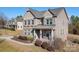 Two story brick home with a front porch and walkway at 6361 Willow Farm Dr, Denver, NC 28037