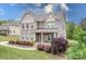 Beautiful two-story brick home with a well-kept lawn and attractive landscaping at 6361 Willow Farm Dr, Denver, NC 28037
