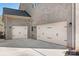 Two-car garage with light-colored doors and extra storage space at 6361 Willow Farm Dr, Denver, NC 28037