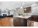 Open kitchen with granite island and hardwood floors at 6361 Willow Farm Dr, Denver, NC 28037