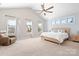 Spacious main bedroom with high ceilings, large windows, and a king-size bed at 6361 Willow Farm Dr, Denver, NC 28037