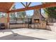 Cozy stone fireplace and seating area under a covered patio at 6361 Willow Farm Dr, Denver, NC 28037