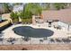 Inviting kidney-shaped pool with safety fence and ample lounge space at 6361 Willow Farm Dr, Denver, NC 28037