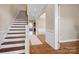 Elegant staircase with hardwood treads and white risers at 6361 Willow Farm Dr, Denver, NC 28037