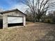 White garage door with open door revealing interior contents at 649 Arch Dr, Rock Hill, SC 29730