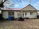 Back of house showing double doors and a damaged recliner at 649 Arch Dr, Rock Hill, SC 29730