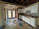 Unfinished kitchen with white cabinets and access to backyard at 649 Arch Dr, Rock Hill, SC 29730