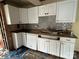 Kitchen with white cabinets and gray backsplash at 649 Arch Dr, Rock Hill, SC 29730