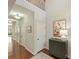 Hallway with hardwood floors, neutral paint, and access to other rooms within the home at 712 English Tudor Ln, Charlotte, NC 28211