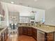 Open-concept kitchen featuring granite countertops and stainless steel appliances with dining area at 712 English Tudor Ln, Charlotte, NC 28211