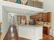 Kitchen with stainless steel appliances and granite countertops, open to the living room at 712 English Tudor Ln, Charlotte, NC 28211