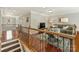 Open-concept living room with hardwood floors and staircase at 712 English Tudor Ln, Charlotte, NC 28211