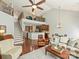 Bright living room with hardwood floors, open layout, fireplace, staircase, and kitchen at 712 English Tudor Ln, Charlotte, NC 28211