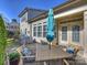 Outdoor patio seating area with grill and multiple access points to the home at 712 English Tudor Ln, Charlotte, NC 28211