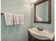 Powder room with single vanity, mirror, and towel rack at 712 English Tudor Ln, Charlotte, NC 28211