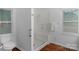 Bathroom showcasing a glass enclosed shower, toilet, tile floor and natural light from two windows at 725 Plantation Rd, Lancaster, SC 29720
