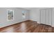 This bedroom features laminate flooring, and two large windows for natural light at 725 Plantation Rd, Lancaster, SC 29720