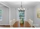 Elegant dining room featuring a chandelier and a large window providing natural light at 725 Plantation Rd, Lancaster, SC 29720