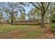 Inviting brick home with a well-manicured lawn and mature trees offering a peaceful setting at 725 Plantation Rd, Lancaster, SC 29720