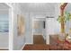 Welcoming home foyer with beautiful wood floors, art and mirror at 725 Plantation Rd, Lancaster, SC 29720