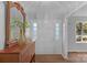 Charming foyer with a decorative mirror and a front door with sidelight windows at 725 Plantation Rd, Lancaster, SC 29720