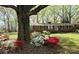 Charming brick home featuring colorful landscaping with red and white azalea bushes in the front yard at 725 Plantation Rd, Lancaster, SC 29720