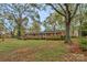 Traditional brick ranch home with a large front yard and mature trees providing shade at 725 Plantation Rd, Lancaster, SC 29720