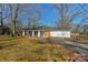 Charming single-story home with a spacious front yard and a driveway at 725 Plantation Rd, Lancaster, SC 29720