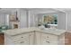 Close-up of a kitchen island with granite countertops and shaker-style cabinets at 725 Plantation Rd, Lancaster, SC 29720