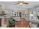 Open concept kitchen and living room area with hardwood floors and stainless steel appliances at 725 Plantation Rd, Lancaster, SC 29720