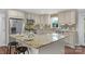 Well-lit kitchen featuring stainless steel appliances, granite countertops, and decorative tile backsplash at 725 Plantation Rd, Lancaster, SC 29720