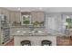 Kitchen island with granite countertops, stainless steel appliances, and modern backsplash at 725 Plantation Rd, Lancaster, SC 29720