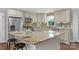 Modern kitchen featuring granite counters, stainless appliances, an island and wooden floors at 725 Plantation Rd, Lancaster, SC 29720