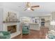 A dining area and kitchen are visible from the cozy living room with fireplace at 725 Plantation Rd, Lancaster, SC 29720