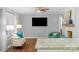 Open floor plan showing hardwood floors and living room with a flat screen television and a fireplace at 725 Plantation Rd, Lancaster, SC 29720
