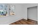 Bright living room with hardwood floors and large window offering a great view to the outside at 725 Plantation Rd, Lancaster, SC 29720