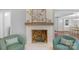 Cozy fireplace with decorative mantle. Comfortable seating arranged around the fireplace at 725 Plantation Rd, Lancaster, SC 29720