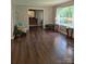 Bright living room with hardwood floors and natural light. Decorative seating arrangements and decor at 725 Plantation Rd, Lancaster, SC 29720