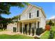 Two-story house with light beige vinyl siding, black shutters, and landscaping at 733 Jones Branch Rd, Fort Mill, SC 29715