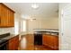 Kitchen with wooden cabinets, dark countertops, and a breakfast bar at 733 Jones Branch Rd, Fort Mill, SC 29715