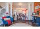 Elegant dining room with hardwood floors, coffered ceiling, and adjacent sitting area at 7505 Torphin Ct, Charlotte, NC 28269