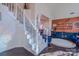 Welcoming foyer with hardwood floors, a staircase with iron railings, and custom paint at 7505 Torphin Ct, Charlotte, NC 28269