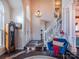 Inviting foyer with hardwood floors, a staircase with iron railings, transom windows and nice décor at 7505 Torphin Ct, Charlotte, NC 28269