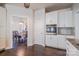 Well-equipped kitchen with white cabinetry, stainless steel appliances, and tiled backsplash at 7505 Torphin Ct, Charlotte, NC 28269