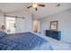 Another view of the main bedroom, highlighting the ensuite bathroom with its sliding door and the bedroom's ample space at 7505 Torphin Ct, Charlotte, NC 28269